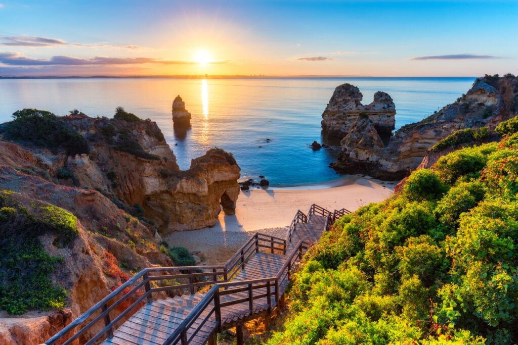 Top 5 Holiday Destinations this Summer | Elect Chauffeurs wooden steps down to secret beach in portugal