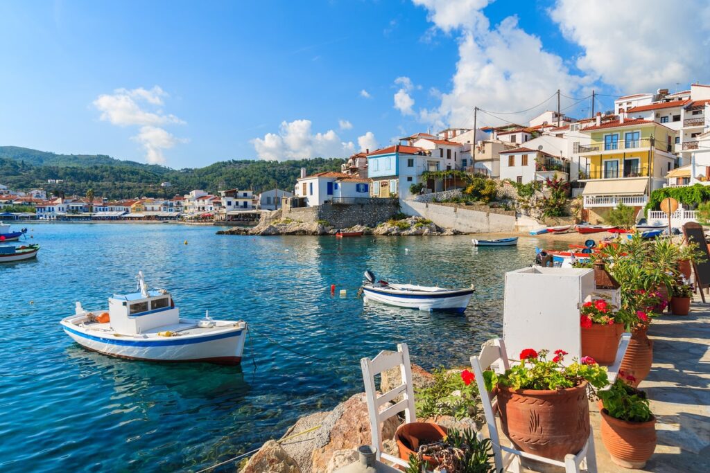 Top 5 Holiday Destinations this Summer | Elect Chauffeurs boat filled bay in greexe - popular holiday destination from dublin airport